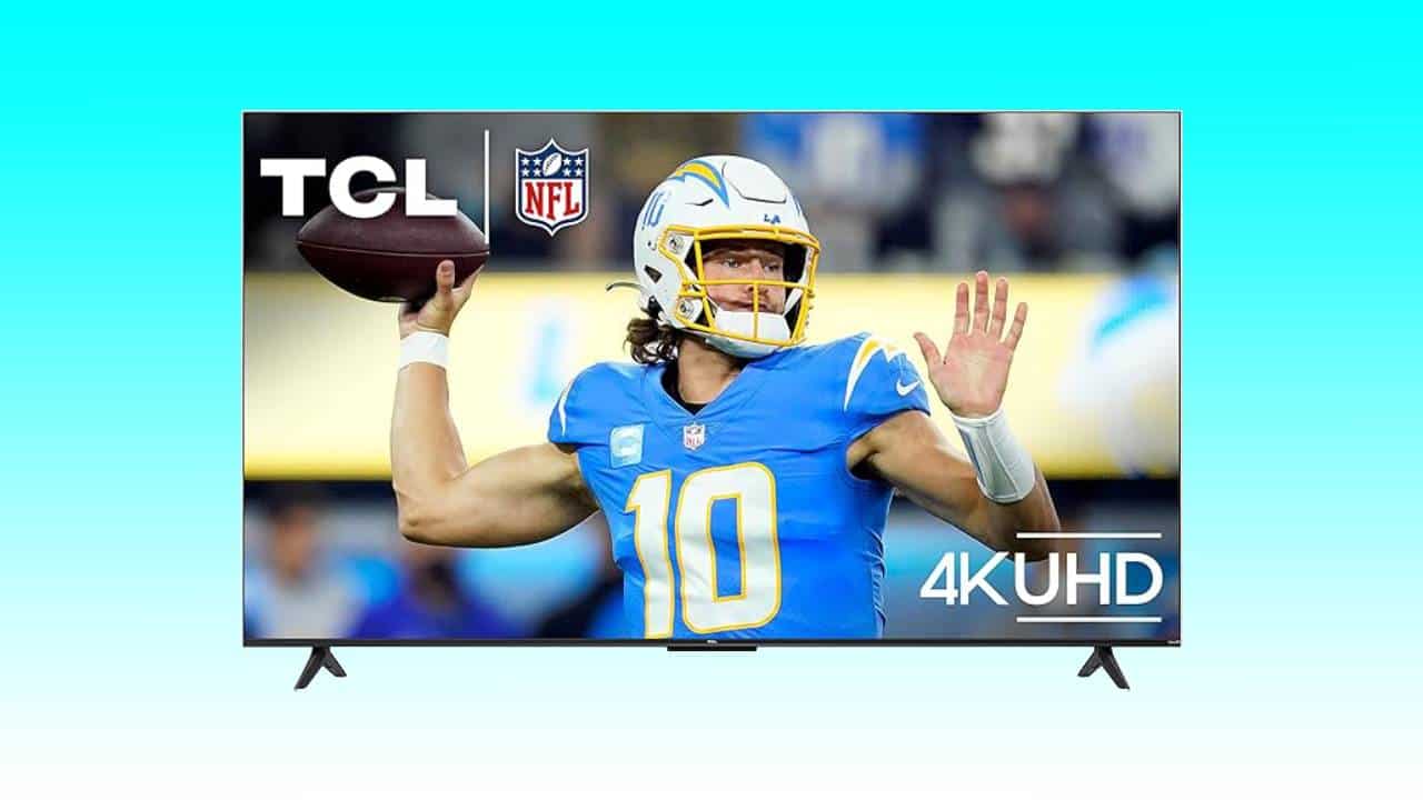 A 50-inch flat-screen TV displays an image of a football player in action, labeled with TCL and 4K UHD logos and an NFL emblem. Perfect for home movies, now available at a 33% reduction.