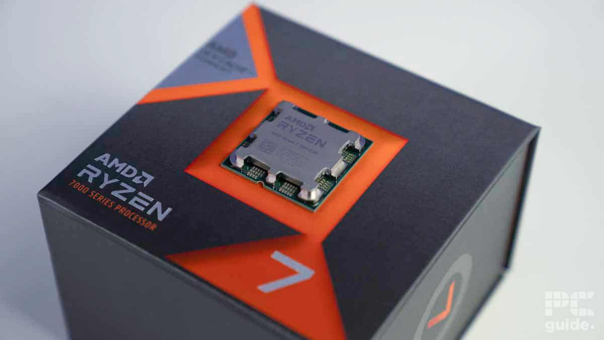 Ryzen 7800X3D CPU resting on top of packaging, image by PCGuide